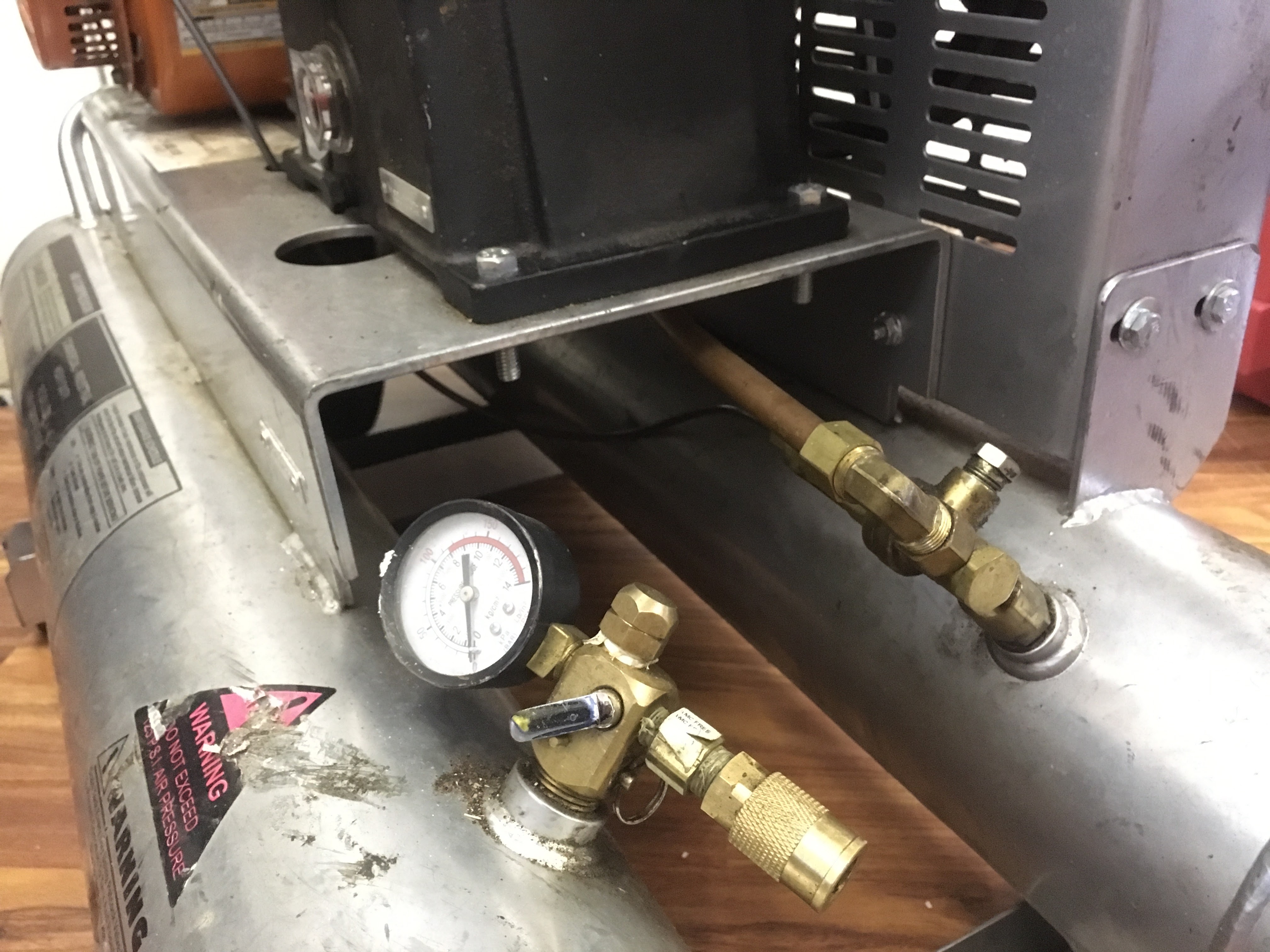 Portable air compressor for roofing nail guns